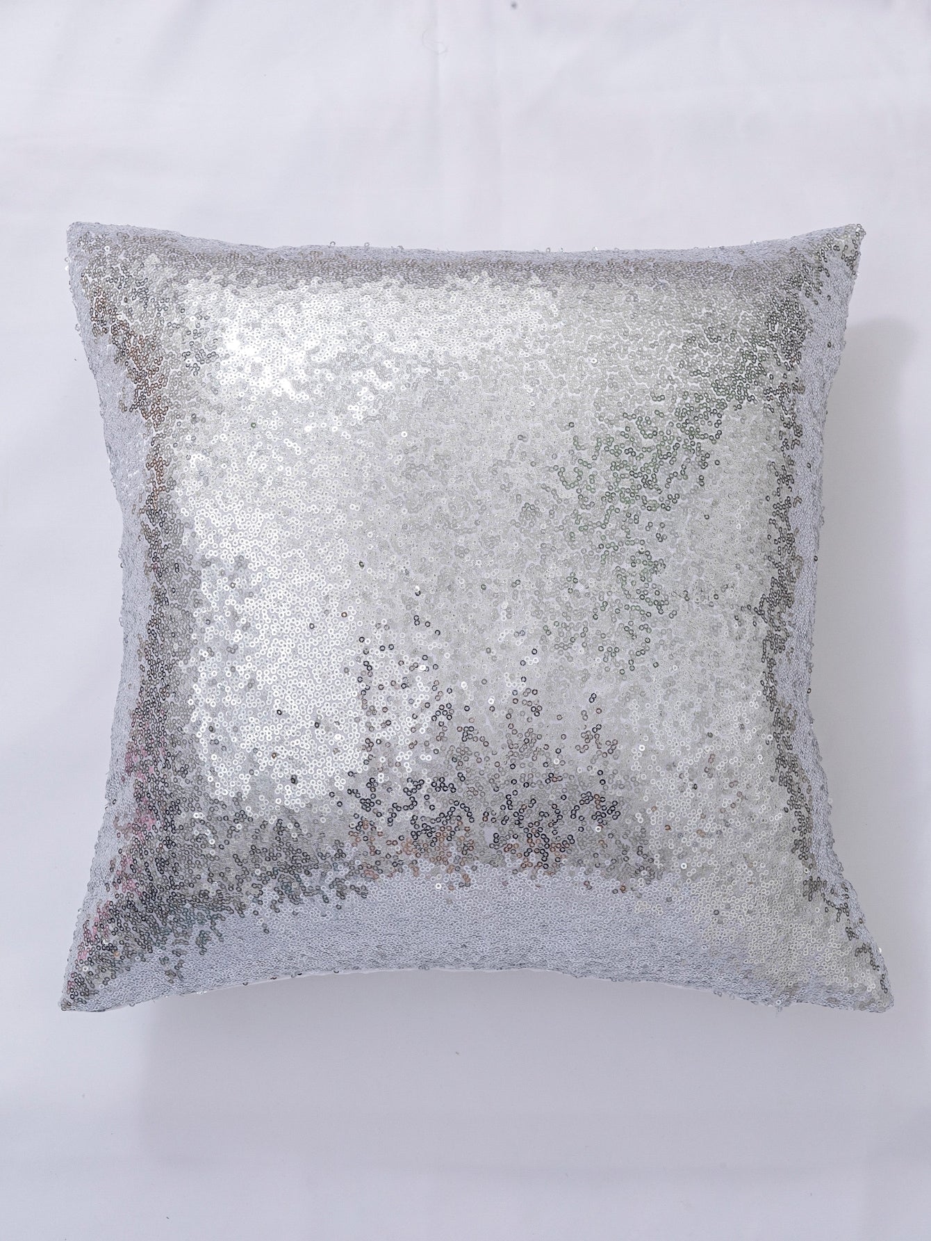 Coussin argenté pailleté